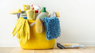 yellow bucket with gloves, cleaning solutions, duster, and scrub brush